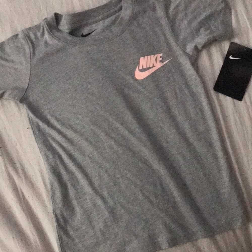 New grey Nike shirt with pink Nike label